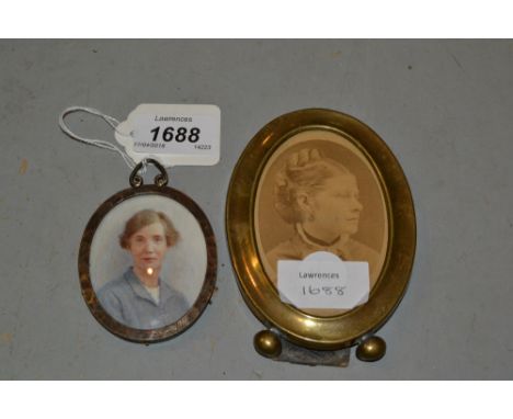 Watercolour portrait miniature of a lady in a pewter frame, together with a brass framed photographic portrait miniature