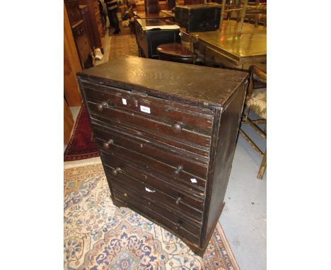 Small oak chest of four drawers with knob handles on bracket feet