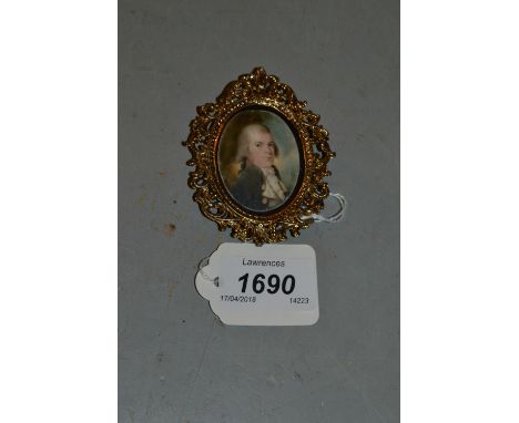 Late 18th or early 19th Century watercolour, portrait miniature on ivory of a gentleman wearing a grey coat, 1.5ins x 1.25ins
