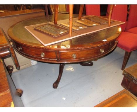 19th Century circular mahogany drum table with a leather inset top above drawers and dummy drawers, raised on turned column a