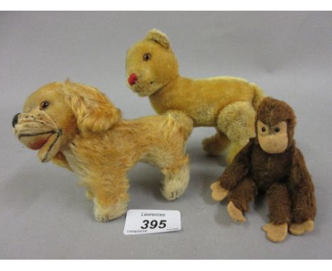 Two small Steiff plush covered animal figures together with another figure