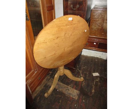 19th Century pine circular pedestal table with tilt top, turned column support and tripod base