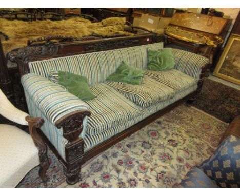 Good quality William IV rosewood sofa with a carved rail back and arms, raised on turned and carved feet