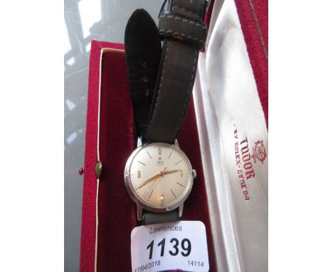 Gentlemans stainless steel Tudor Royal wristwatch, the champagne dial with Arabic and baton numerals, matching gilt hands and