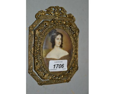 Watercolour, portrait miniature of a lady wearing a brown dress and pearl drop to her forehead, in an ornate Continental pier