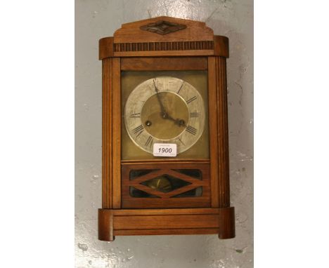 Art Deco walnut cased mantel clock with silvered chapter ring, Roman numerals and two train movement