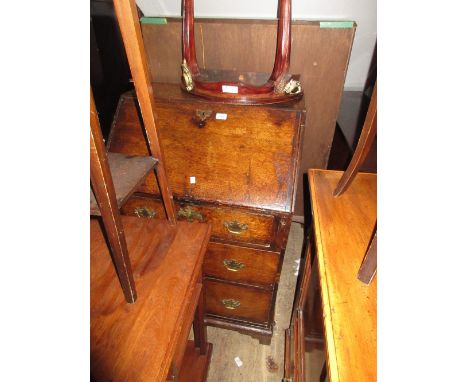 Antique oak bureau with a fall front enclosing a fitted interior above three drawers with brass handles on bracket feet (with