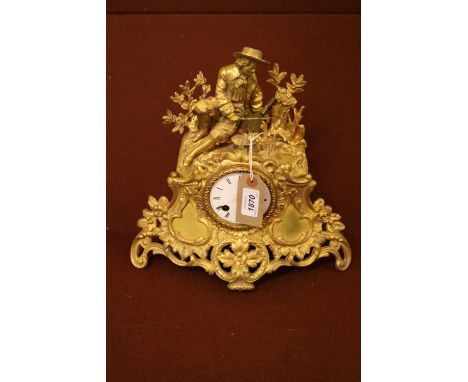 19th Century French ormolu mounted clock surmounted by a seated figure fishing, having circular enamel dial with Roman numera