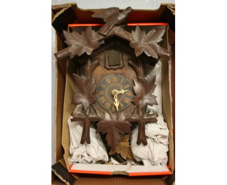 Black Forest carved cuckoo clock including pendulum and weights
