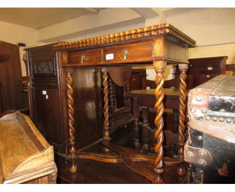 Early 20th Century beechwood rectangular fold-over card table with a shaped top on barley twist supports with crossover stret