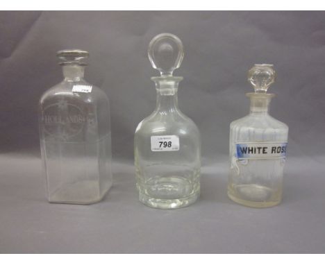 Late 18th or early 19th Century Hollands decanter, a 19th Century chemists bottle with enamel label, White Rose together with