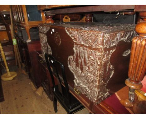 Large Chinese carved camphor wood trunk having hinged cover