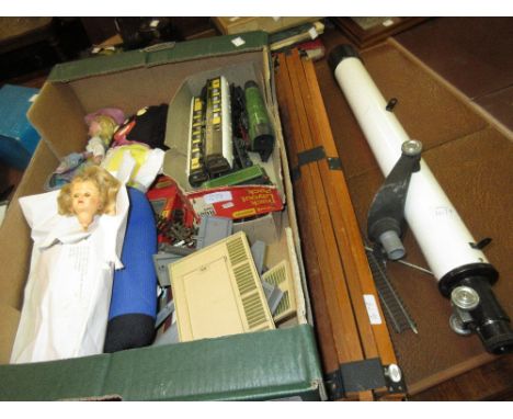 Pelham puppet (lacking box), quantity of 0 gauge railway carriages and accessories together with a children's microscope on s