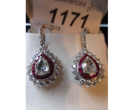 Pair of 18ct white gold ruby and diamond drop earrings, the central rose cut diamonds approximately 0.68ct total, the rubies 