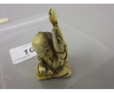 Small 19th Century carved ivory netsuke of a seated figure