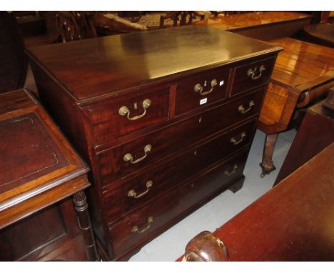 George III mahogany chest of three short over three long graduated drawers having original brass swan neck handles, raised on