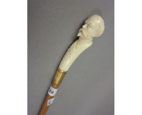 Late 19th / early 20th Century ivory handled Malacca walking stick carved in the form of a Victorian gentleman wearing a sash