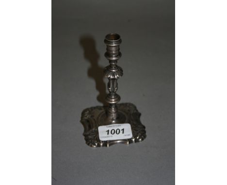 Antique cast silver knop stem candlestick of small form on square base, dated 1754 (lacking sconce)