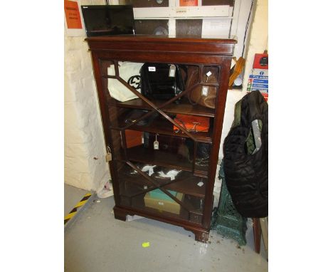 Early 20th Century mahogany side cabinet / bookcase, the moulded cornice above an astragal glazed door enclosing adjustable s