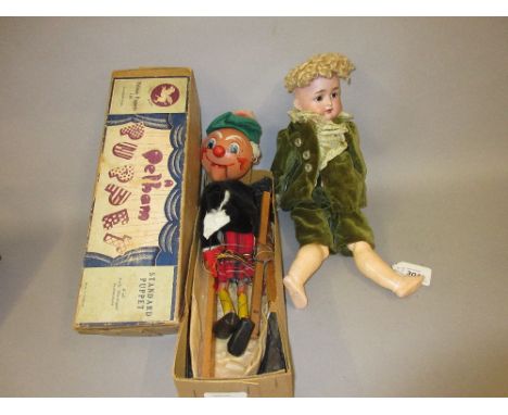 Simon Halbig bisque headed doll with sleeping eyes and open mouth with four teeth, on a jointed composition body, dressed in 