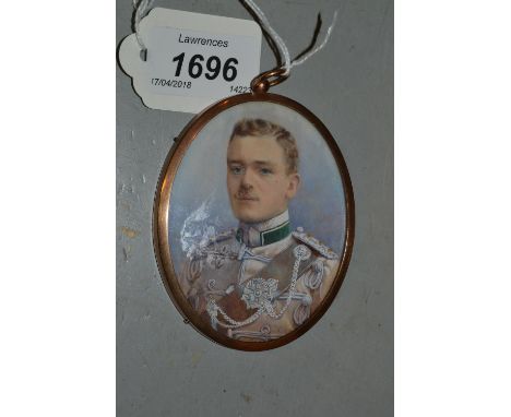 G.L. Penny, watercolour, portrait miniature on ivory of a young man wearing a military uniform, signed and dated 1917, 3.75in
