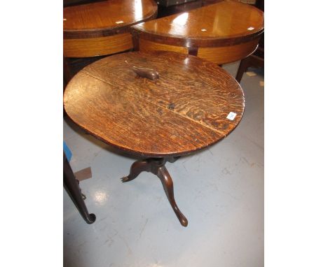 George III oak circular pedestal table with a vase turned column support and tripod base