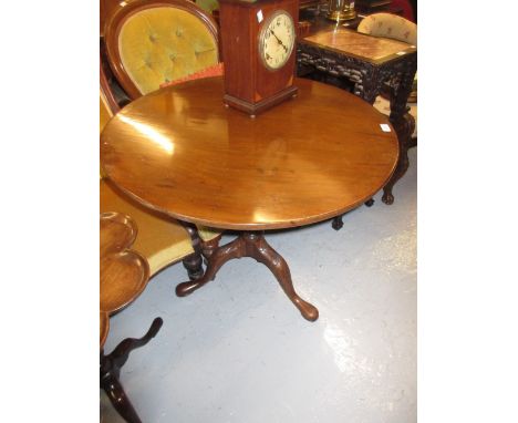 19th Century mahogany circular pedestal table in George III style, the tilt top above a wrythen baluster column and carved tr