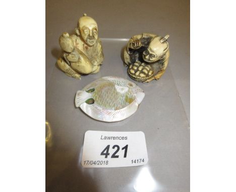 Two 20th Century composition netsuke and another mother of pearl netsuke in the form of a fish