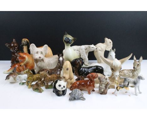 Assortment of ceramic animal figurines, to include Sylvac sausage dog, Sad Sam spaniel and Terrier 1415, Szeiler long eared c
