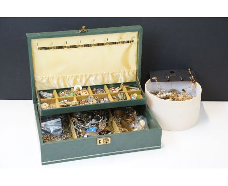 A collection of mixed costume jewellery and enamel badges within a vintage jewellery box and tub. 