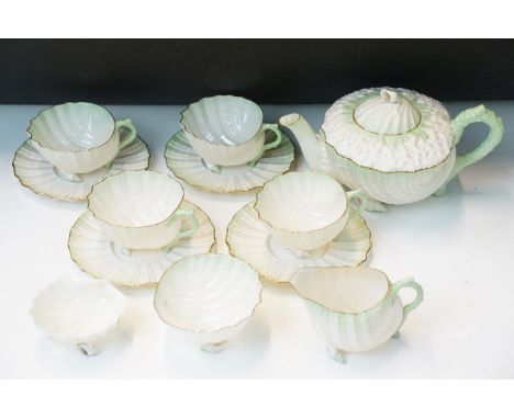Early 20th century Irish Belleek porcelain Neptune sea shell shaped tea service set, comprising of four tea cups and saucers,