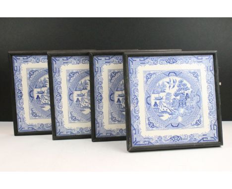 Set of four framed blue and white willow pattern style tiles, tile size, W 20.5cm x D 20.5cm