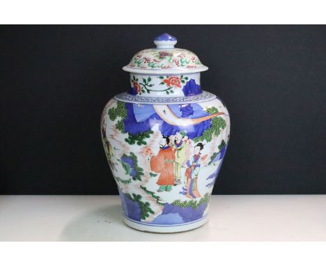 Kang Xi Chinese ginger jar having a baluster shaped vase with lid to top featuring a garden landscape scene with blue undergl