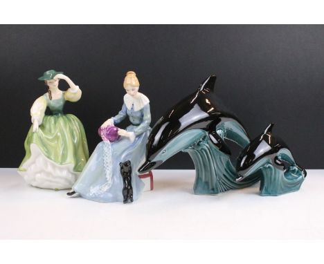 Royal Doulton 'Buttercup' HN 2309 modelled by Peggy Davies and 'Dorothy' HN 3098, together with a pair of Poole Pottery dolph