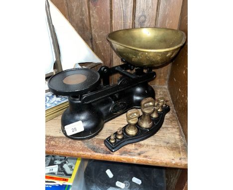 A set of Salter Staffordshire kitchen scales with a set of Brass Bell weights on a Tray 