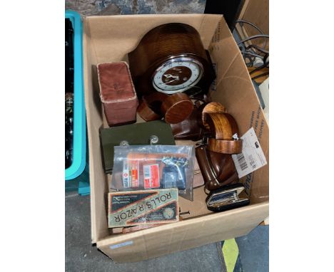A box of assorted items including a Smiths mantle clock, razors, Art Deco bookends, cash tins etc. 