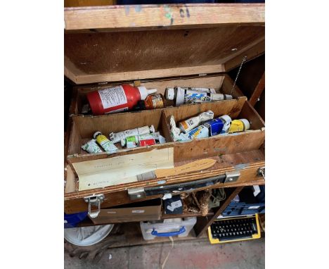 A box of assorted vintage acrylic tube paints. 