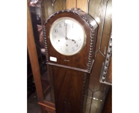 A 1930s mahogany cased granddaughter clock. 