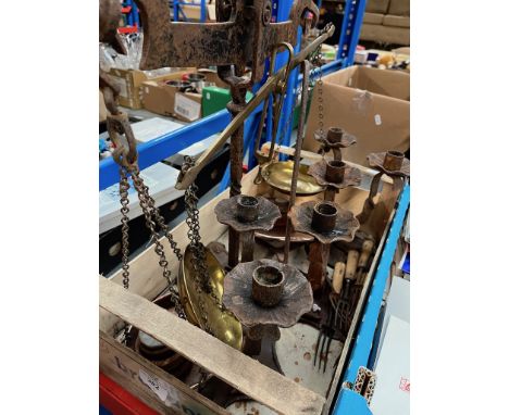 A set of old balance scales and weights together with cast metal candle sticks and some forks. 
