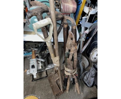 Two bundles of various garden tools. 
