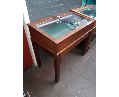 A mahogany cased museum display cabinet on stand with internal light and two keys.Dimensions- height 98.5cm, width 111.5cm an