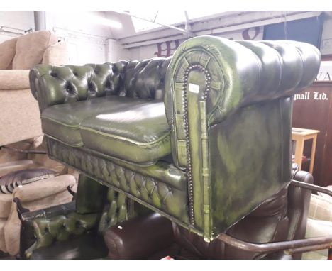 A green leather Chesterfield 2 seater sofa. 