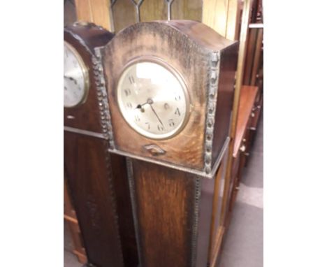 A 1920s oak cased granddaughter clock. 