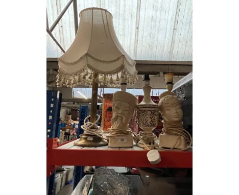 A brass column table lamp and 3 eastern design pottery lamps 