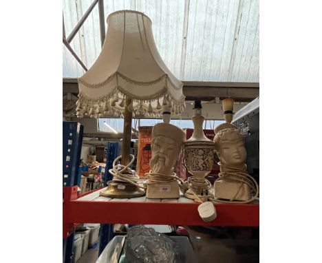 A brass column table lamp and 3 eastern design pottery lamps 