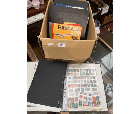 A box of stamp albums and first day covers 