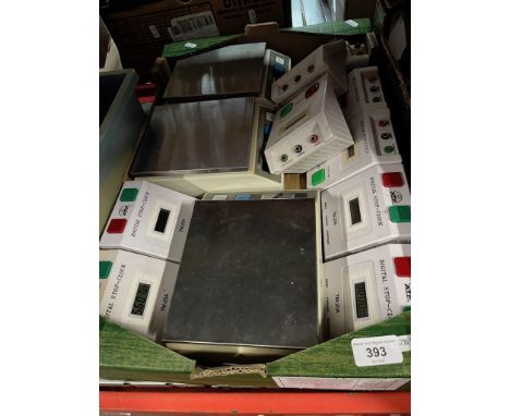 A box of digital scales and stop clocks. 