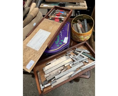 3 boxes of wood turning tools and a box of honing stones 