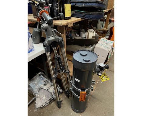 A Celestron AstroMaster 130 telescope with tripod. 
