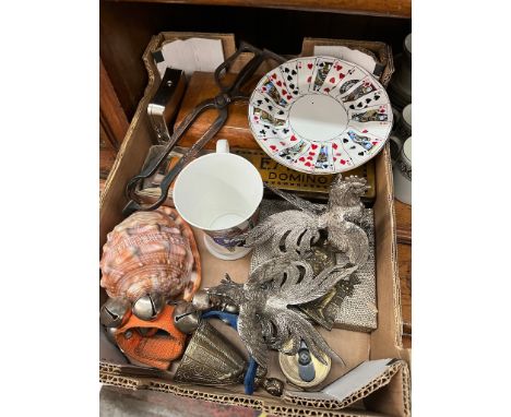 A box of collectables including brass lady bell, carved shell, vintage games inc travel chess etc, WE-BO pig tape measure. 